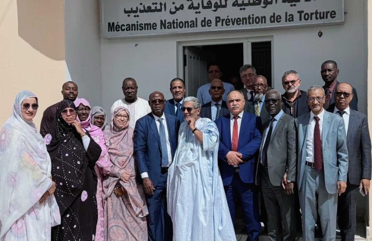 Group shot of NPM team outside their office